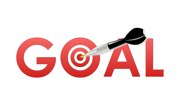 This is a picture of the words GOAL written in red and an arrow in the middle of the letter O in the word GOAL